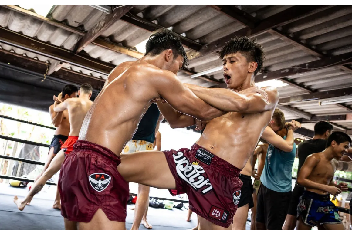Kru Yothin FA Group leading a private Muay Thai training session at FA Group Muaythai Gym, teaching techniques to an enthusiastic student