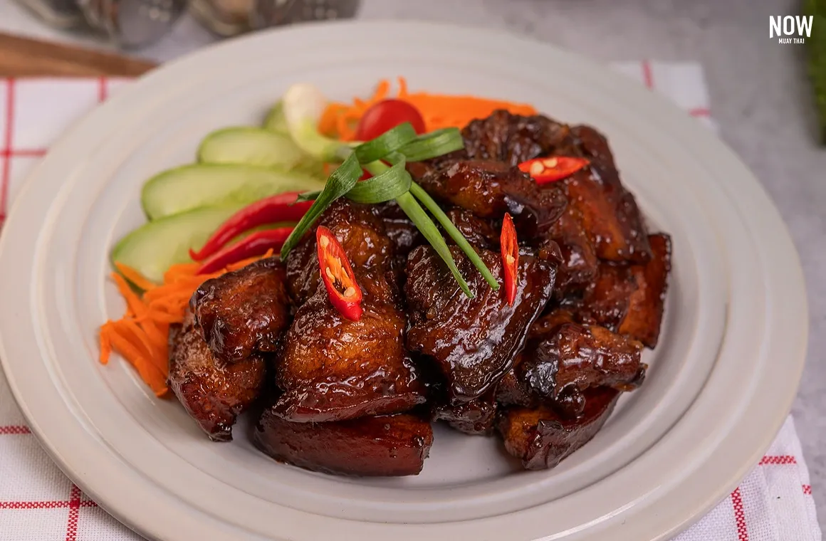 Moo Hong, a Southern-style braised pork belly dish simmered in a rich soy-based sauce, offering tender meat and a savory-sweet flavor loved by locals and visitors alike.