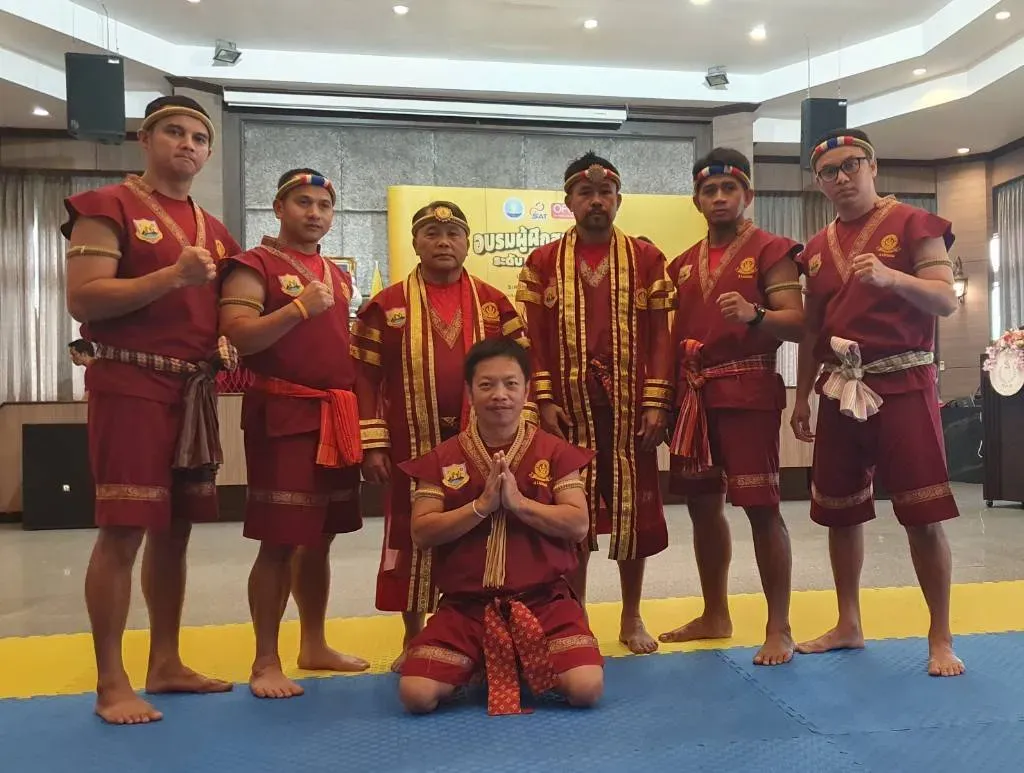 Muay Thai students learning traditional techniques and partner drills at Danmuang Muay Thai Chiang Mai