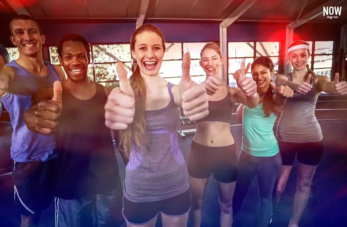 Diverse group of people training Muay Thai together, connecting through Thai culture and building a strong fitness community